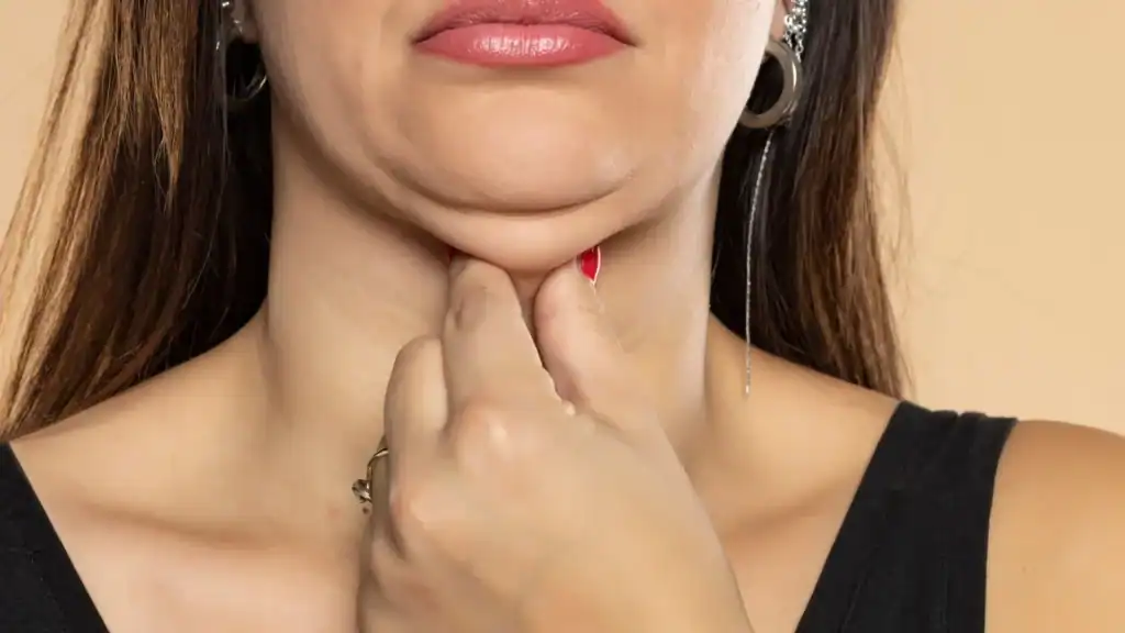 An image of a woman with double chin, sad, worried : Non Surgical Double Chin Removal Treatment in Fairfield, UK